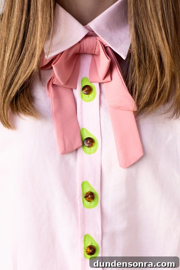 DIY Avocado Buttons: How to Make Stylish Avocado Jewelry at Home 2 A close up of shirt with avocado buttons