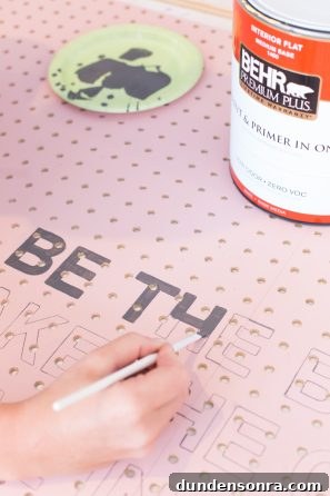 Creative Pegboard DIY Ideas for Stylish Home Organization 11 A pink wooden board being painted