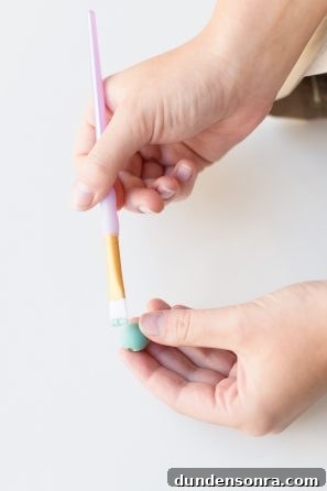 Creative Pegboard DIY Ideas for Stylish Home Organization 13 Someone holding a paintbrush