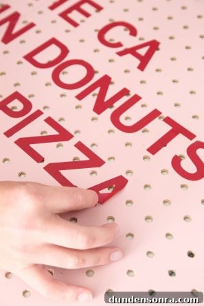 Creative Pegboard DIY Ideas for Stylish Home Organization 8 Board with red words on it