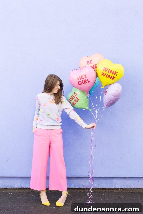 Conversation Heart Pattern Sweatshirt with Stylish Elbow Patches 13 A woman holding balloons
