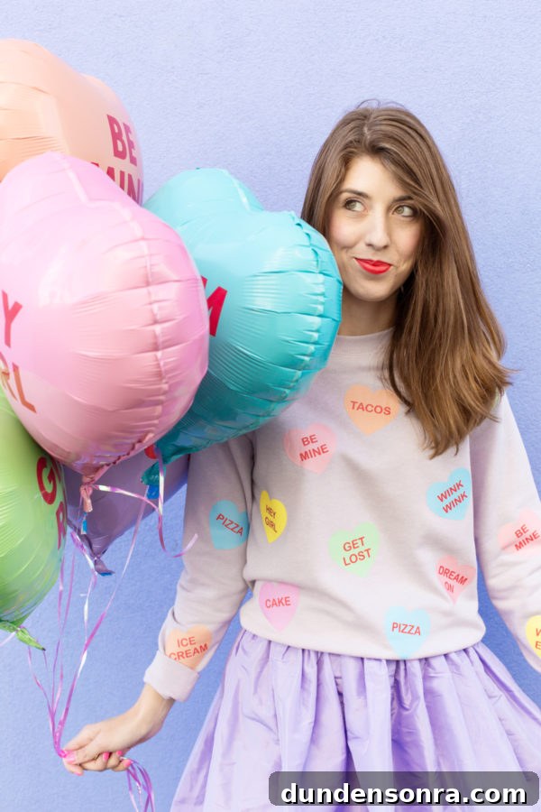 Conversation Heart Pattern Sweatshirt with Stylish Elbow Patches 3 A woman and colorful balloons