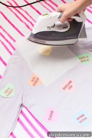 Conversation Heart Pattern Sweatshirt with Stylish Elbow Patches 8 Heart patches being ironed onto a shirt