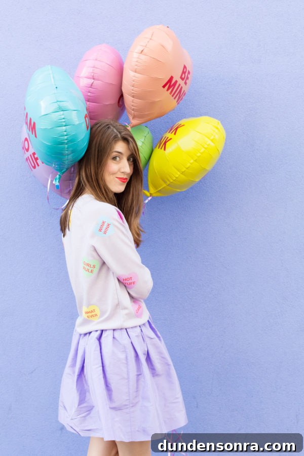 A woman holding colorful balloons