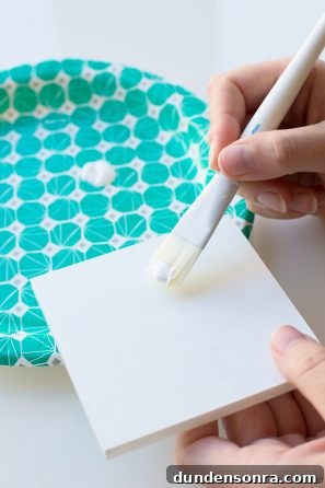 DIY Pom-Pom Storage Boxes: Stylish Craft Organization Ideas 5 White square and paint brush