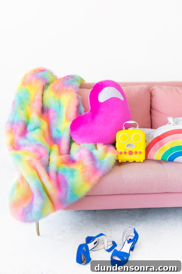 Rainbow blanket on a pink couch