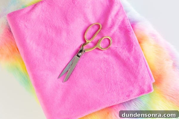 Pink fabric and scissors