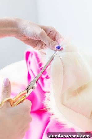 Someone cutting a fluffy blanket