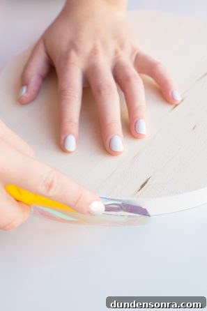 Someone touching a wooden circle