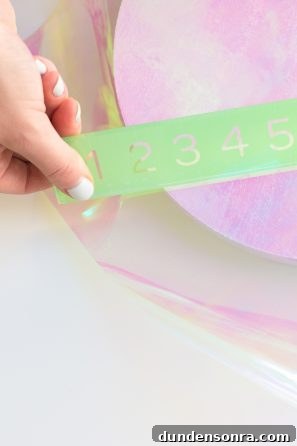Someone holding a green ruler