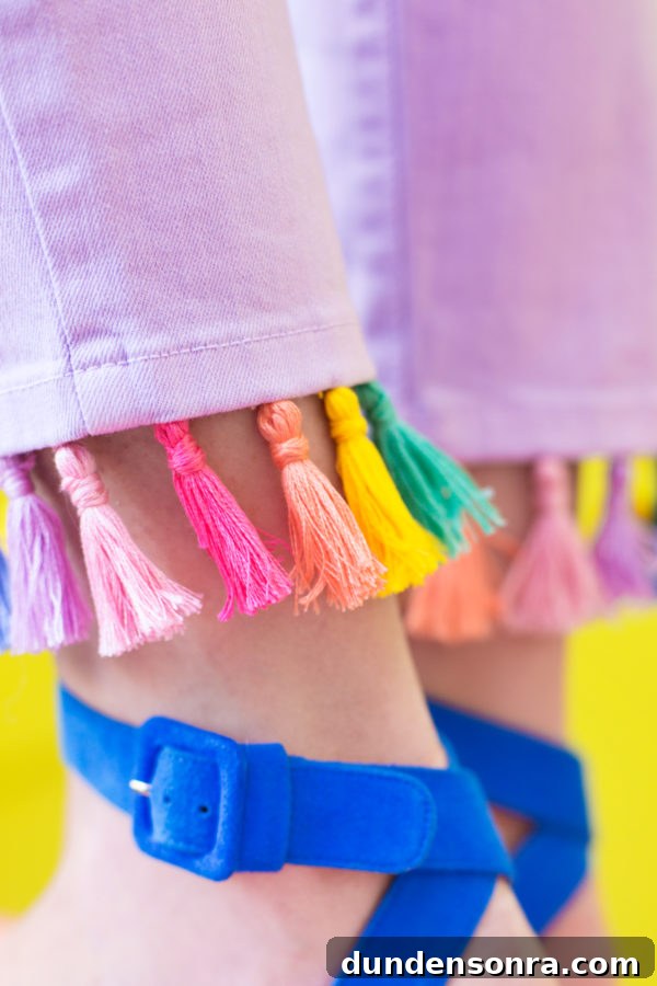 Purple jeans with rainbow tassels