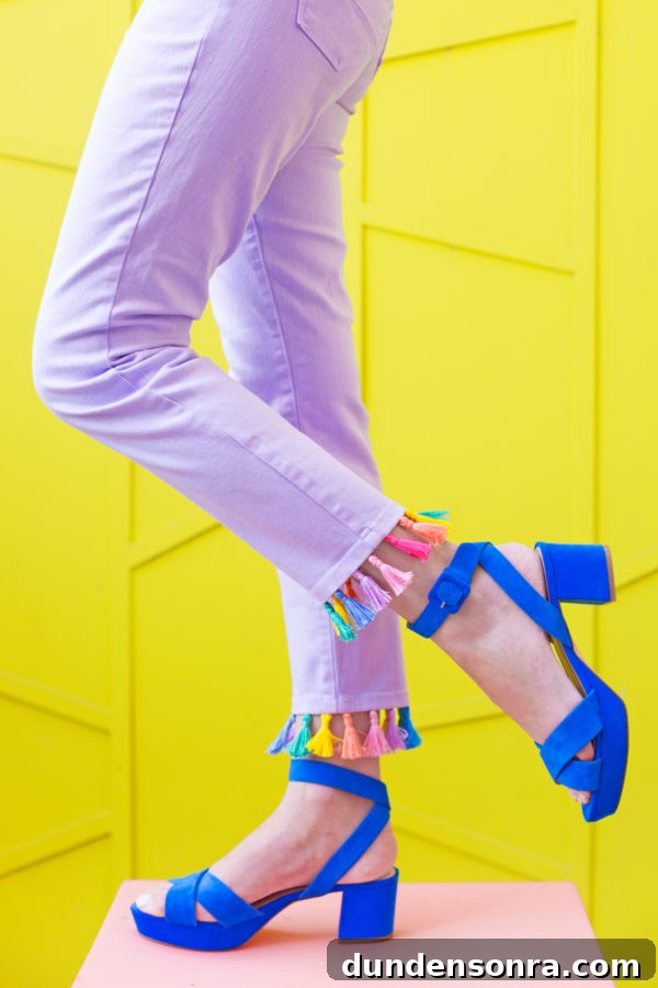 Purple jeans with rainbow tassels