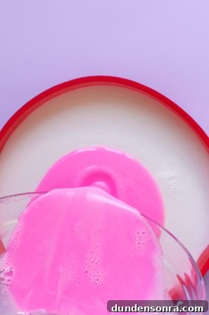 How to Make a Birthday Cake Soap That Smells Like Cake 12 Someone pouring a pink substance
