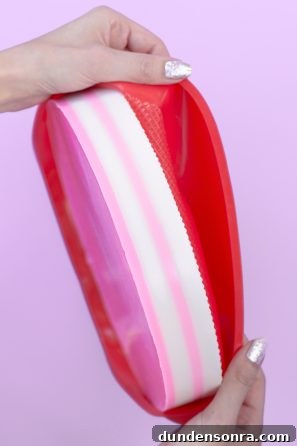 How to Make a Birthday Cake Soap That Smells Like Cake 13 Someone stretching something