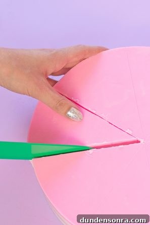 How to Make a Birthday Cake Soap That Smells Like Cake 14 Someone cutting a slice of soap