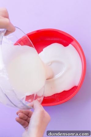 How to Make a Birthday Cake Soap That Smells Like Cake 8 Someone pouring a substance into a bowl