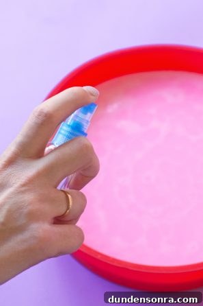 How to Make a Birthday Cake Soap That Smells Like Cake 10 Someone spraying something