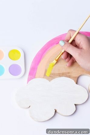 Someone painting a rainbow