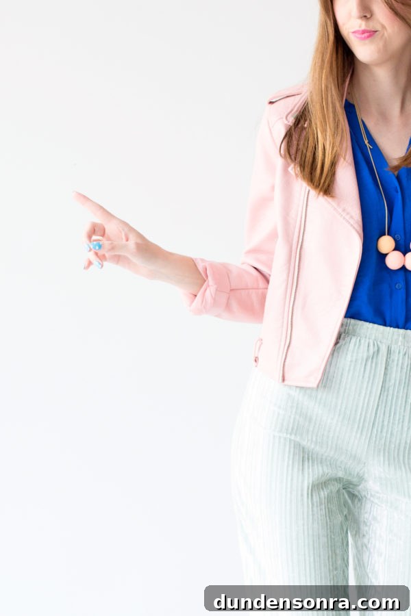 A woman wearing a pink jacket