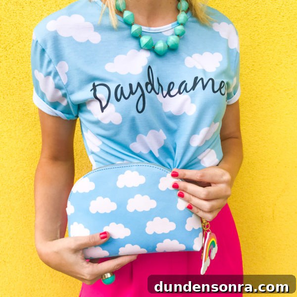 What’s in My Clutch: Everyday Essentials from Splendid Rags 5 A girl wearing a cloud shirt and holding a cloud clutch