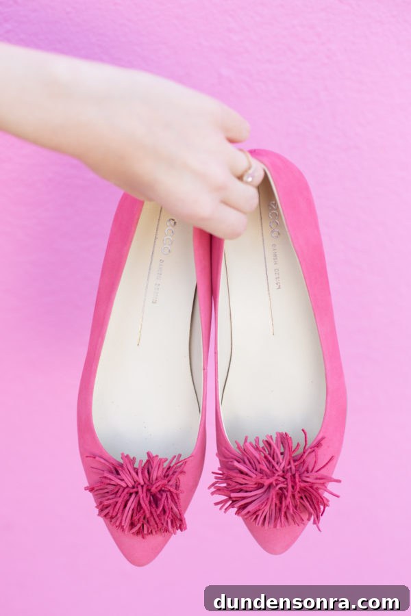 Someone holding pink slippers