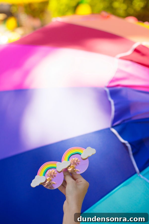 Someone holding rainbow glasses