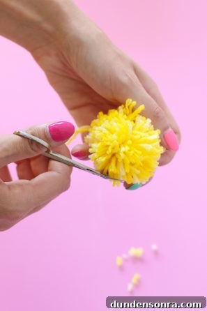 A person holding yellow strings