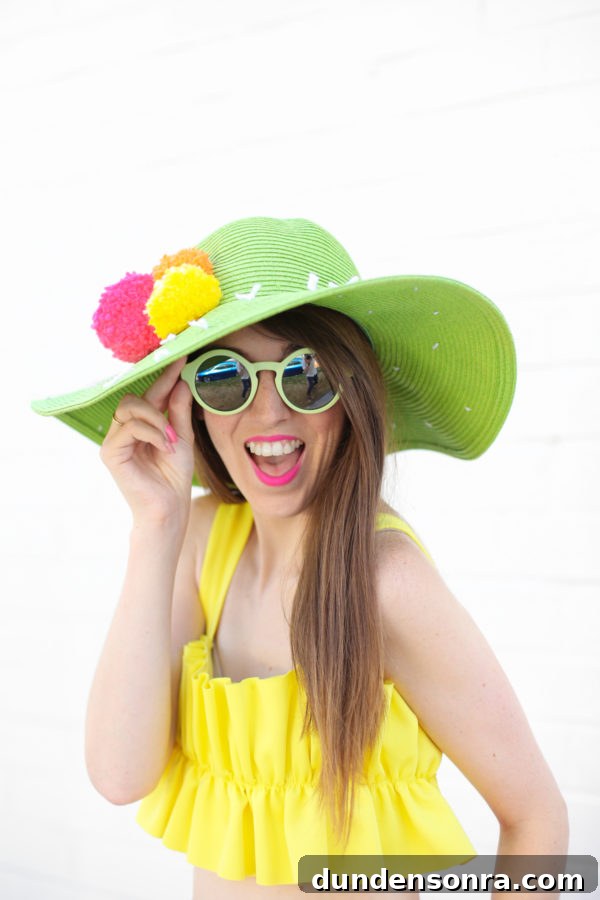 A woman wearing a hat and sunglasses