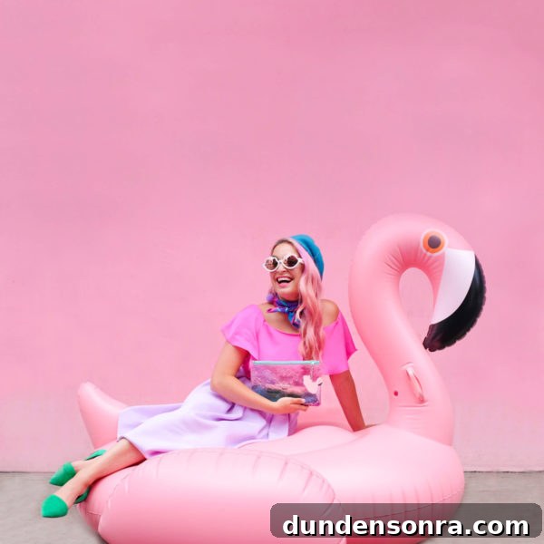 What's In My Clutch: Hot Pink Pineapple Accessories 7 A woman sitting on a flamingo floatie