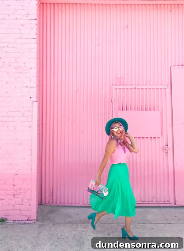 What's In My Clutch: Hot Pink Pineapple Accessories 9 A girl in front of a pink building