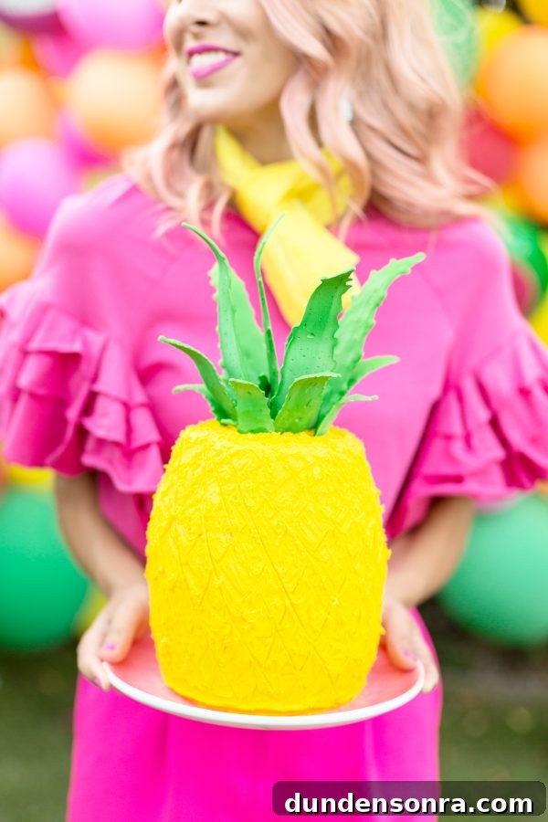 A woman holding a pinapple 