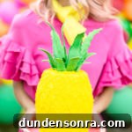 A woman holding a pinapple