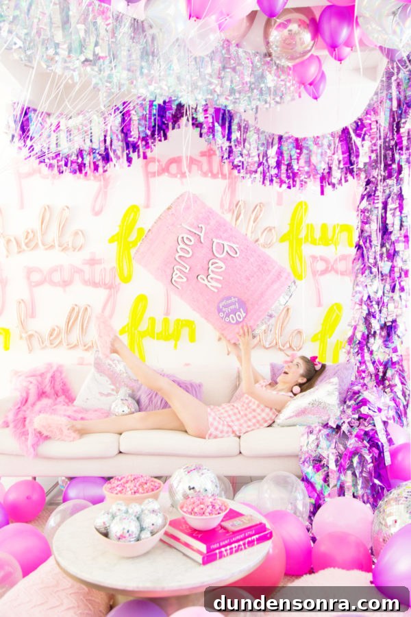Someone holding a pink pinata