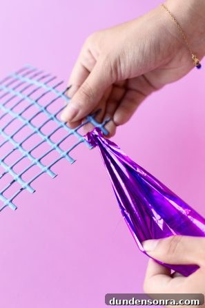 Make Your Own Mylar Party Streamers: Simple DIY Guide 6 A paper and hands