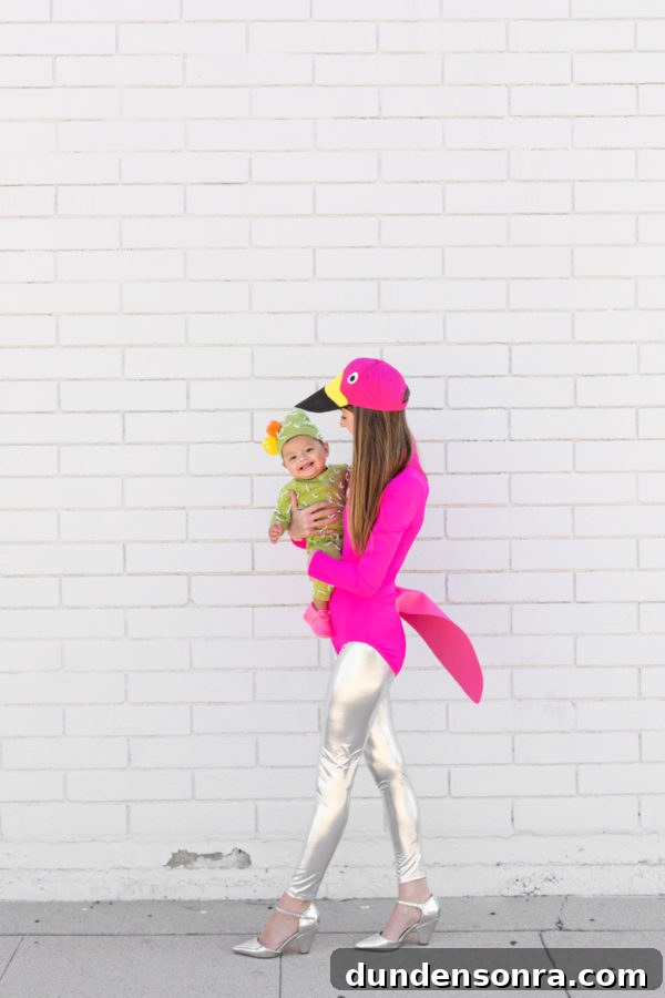 DIY Flamingo Lawn Costume and Cute Cactus Baby Outfit 5 A person dressed as a flamingo and a little boy dressed as a cactus