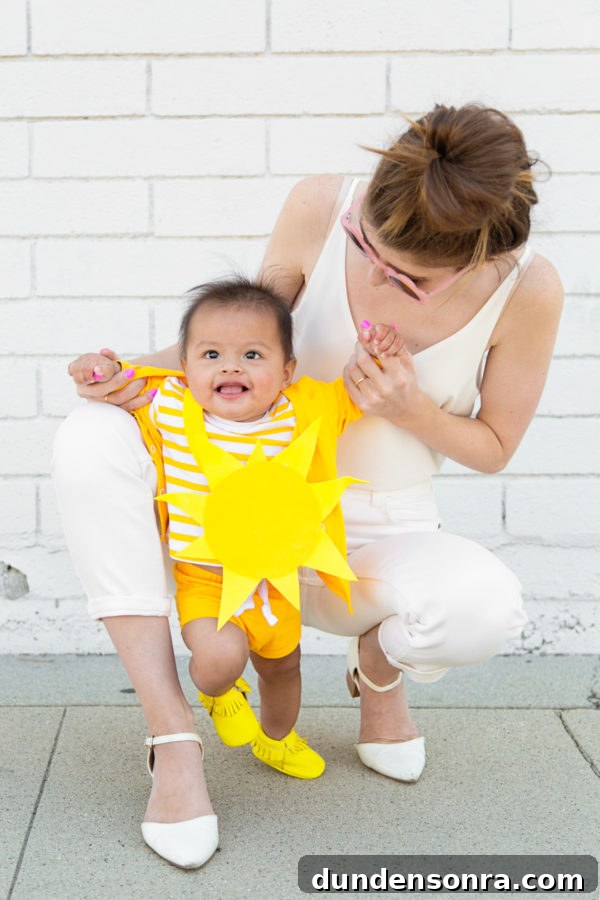 A little boy dressed as a sun