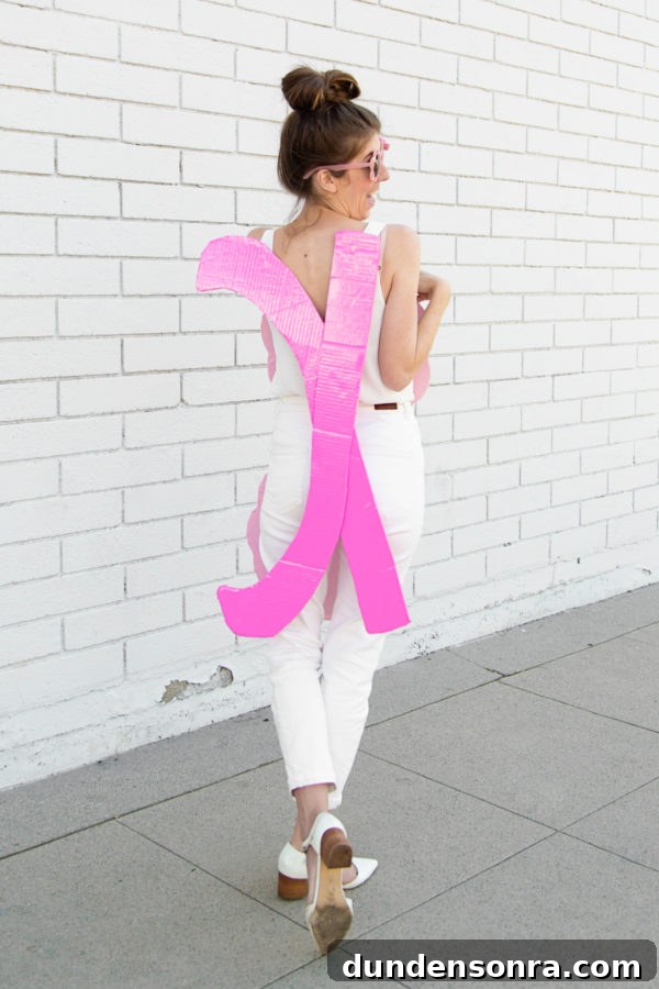 A woman holding pink cardboard 