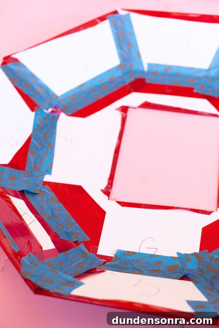 DIY Ring Pop Costume Ideas for a Show-Stopping Halloween 7 Red paper cut-outs and tape