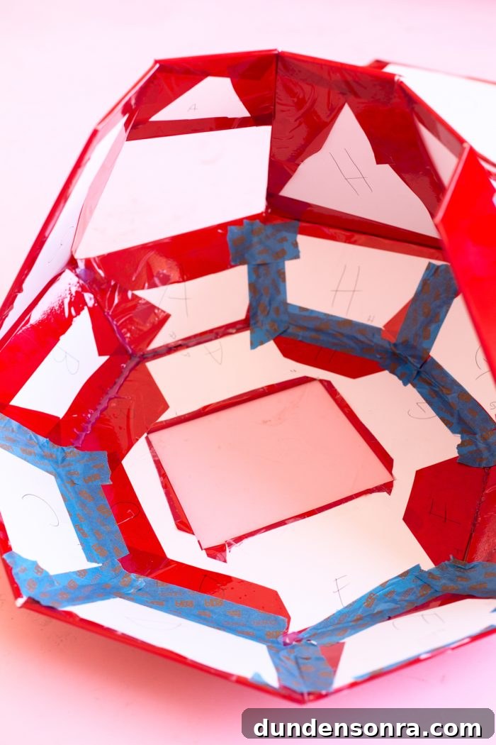 DIY Ring Pop Costume Ideas for a Show-Stopping Halloween 8 Red paper and blue tape