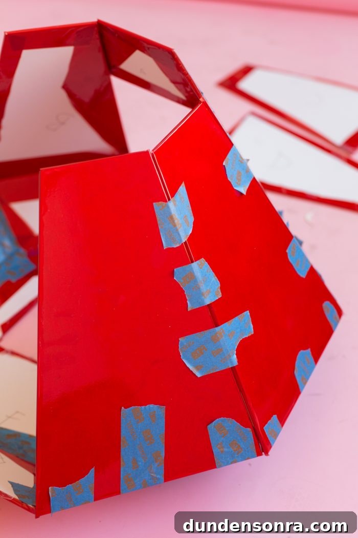 DIY Ring Pop Costume Ideas for a Show-Stopping Halloween 9 Red paper and blue tape