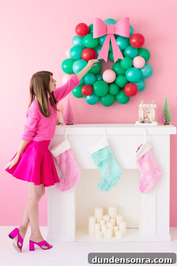 Someone touching a balloon wreath