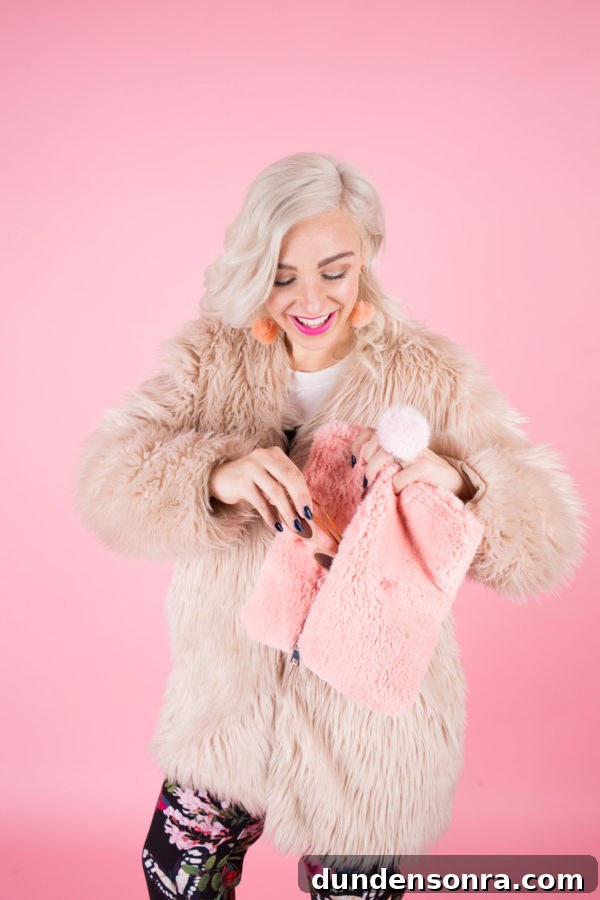 A woman with white hair holding a clutch