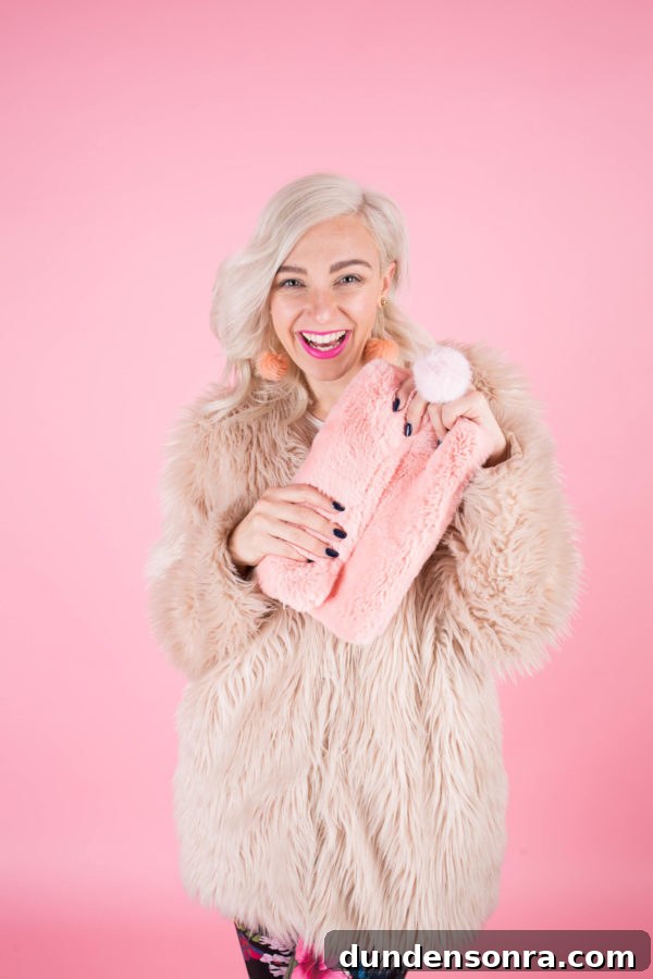 Someone holding a pink clutch