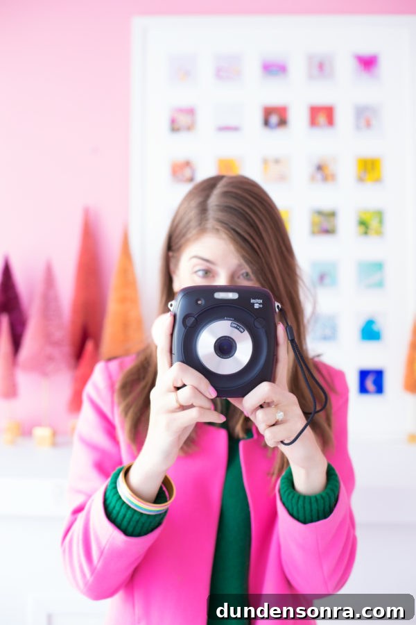 DIY Rainbow Photo Collage Using Instax Square Photos 4 A woman standing in front of an art piece