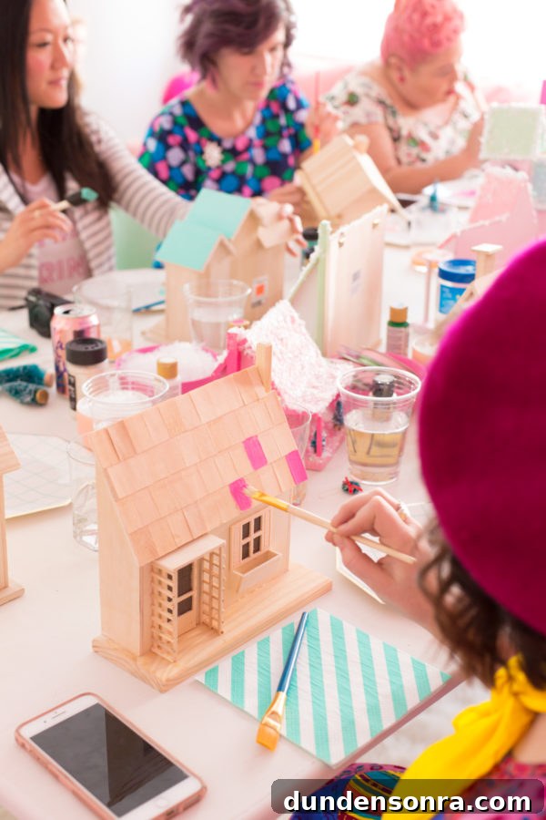 Crafty Christmas Brunch Ideas: Festive Recipes & DIY Decor 14 Someone painting a wooden house
