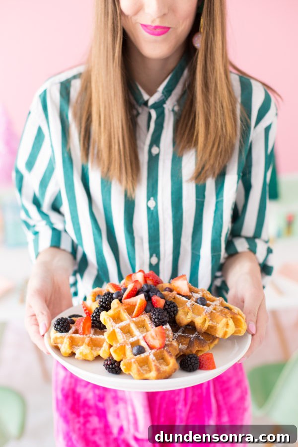 Crafty Christmas Brunch Ideas: Festive Recipes & DIY Decor 5 Someone holding a plate of waffles