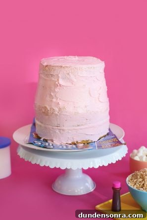 How to Make a Nail Polish Cake: DIY Step-by-Step Guide 7 A pink cake sitting on top of a table