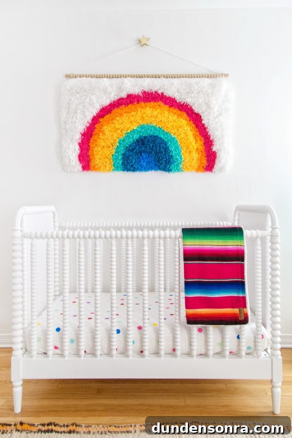A crib with colorful sheets