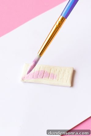 DIY Palm Springs Easter Egg Decor: Bright, Midcentury Craft Ideas 7 Someone painting clay