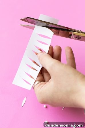 DIY Palm Springs Easter Egg Decor: Bright, Midcentury Craft Ideas 9 Someone cutting paper